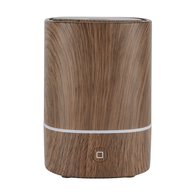 Front view of Ember dark wood grain aroma diffuser on a white background